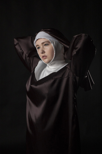 Catholic nun On black - Zdjęcie, obraz