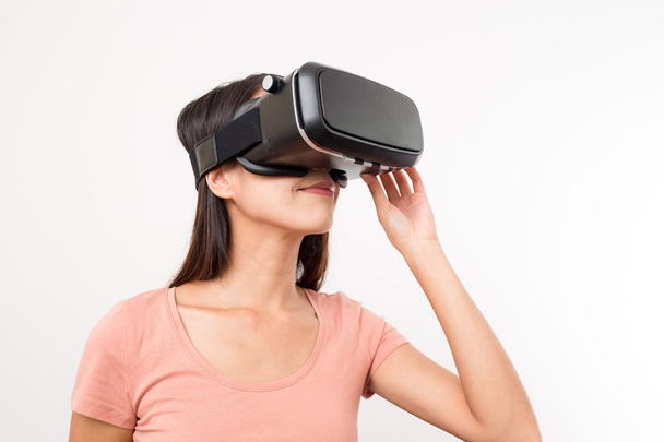 Woman looking though virtual reality  - Фото, зображення