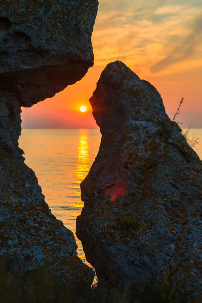 Sunset over the Sea of Azov on Generals beach. Karalar regional landscape park in Crimea. - 写真・画像