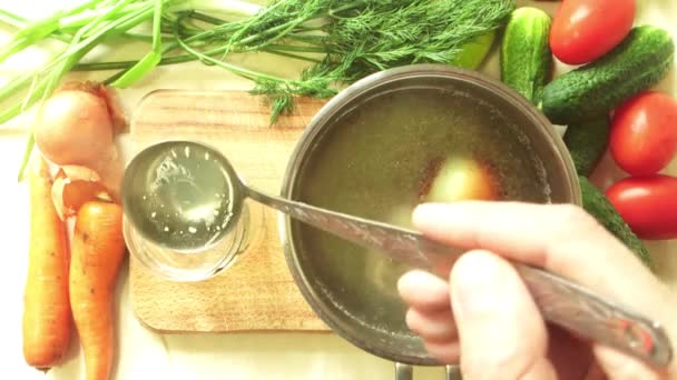 Man pours chicken broth in a glass jar - Footage, Video