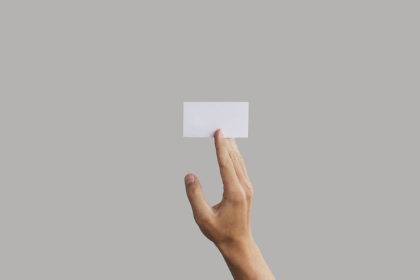 Businessman's hand holding blank paper business card, closeup is - Φωτογραφία, εικόνα
