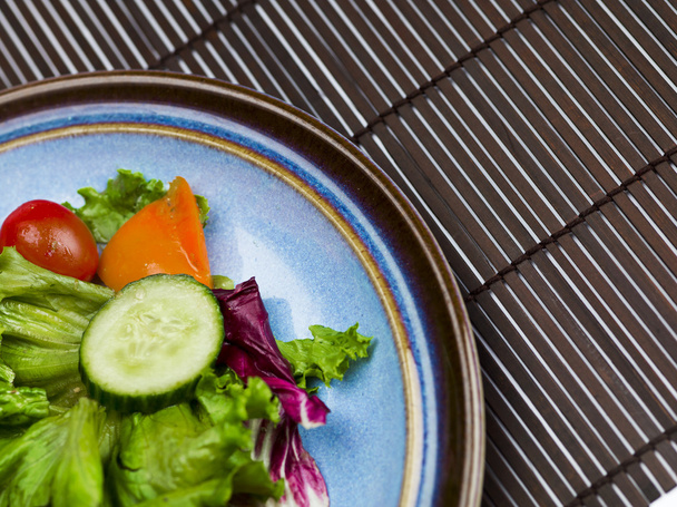 Vegetable salad on a plate - Фото, изображение