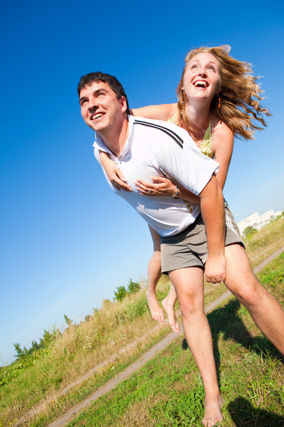 Couple fooling around outdoors - Photo, Image