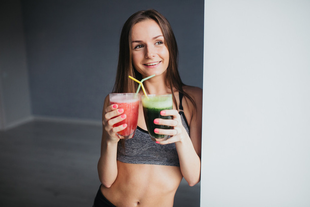young girl with detox drinksafter workout - Photo, Image