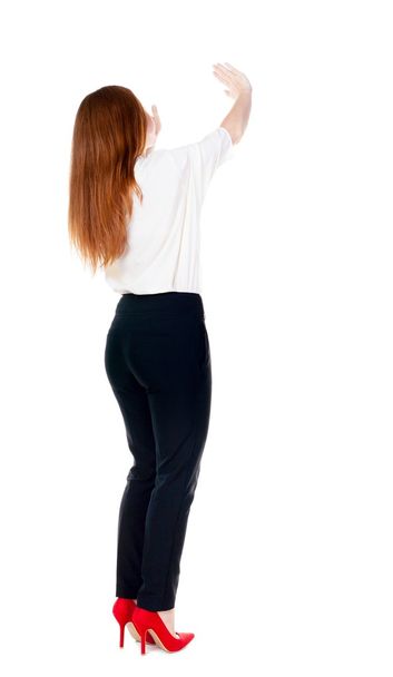 Back view of beautiful business woman welcomes. - Foto, Imagen