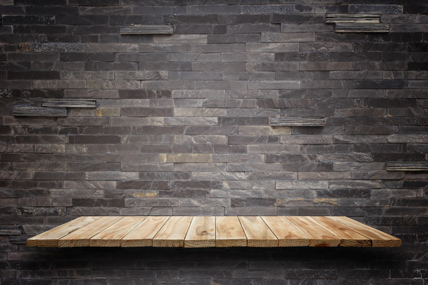 Empty wooden shelves and stone wall background. For product disp - Photo, Image