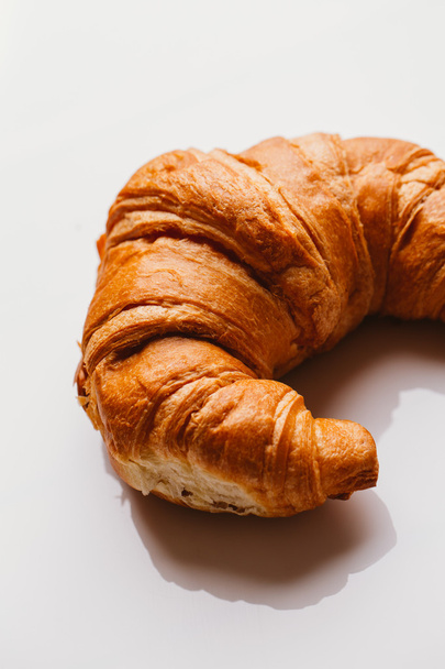 fresh croissant from the puff pastry on a white background - Photo, Image