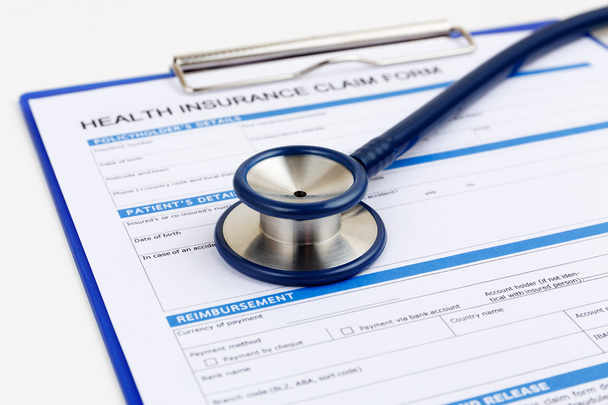 Stethoscope on health insurance form - Photo, Image