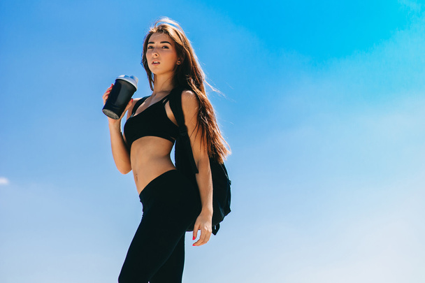 Fitness girl with a shaker - Photo, image