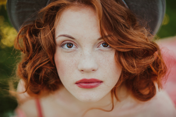Portrait of a young redhead woman - Foto, imagen