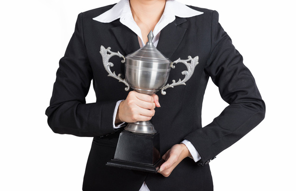 Businesswoman celebrating with holding trophy award for success  - Photo, Image