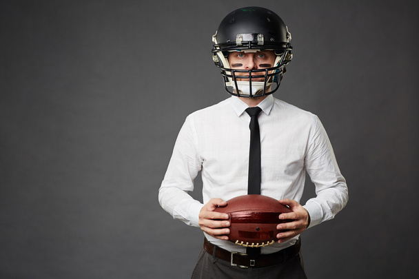Businessman ready to play rugby - Photo, Image