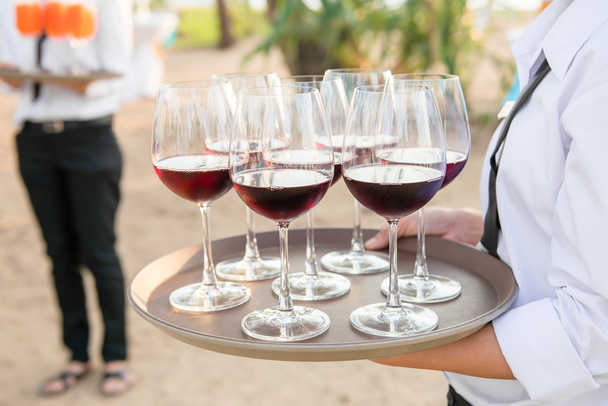 Glasses of wine serving at beach side events. - Photo, Image