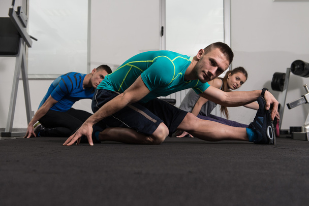 Group Of Sportive People In A Gym Training - Fotografie, Obrázek