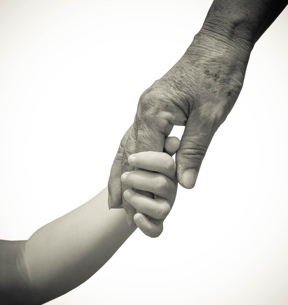 рука маленького ребенка, трогающего старую руку
  - Фото, изображение