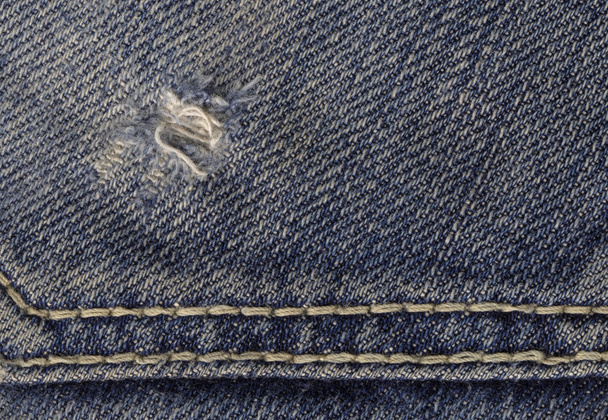 Close up van blauwe jeans stof  - Foto, afbeelding