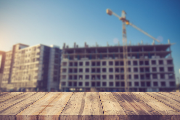 wood table top on blur background of construction site on vintag - Φωτογραφία, εικόνα