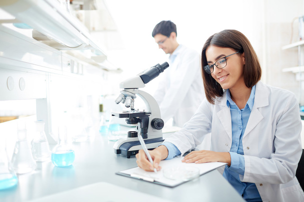 young scientist making notes - Photo, Image
