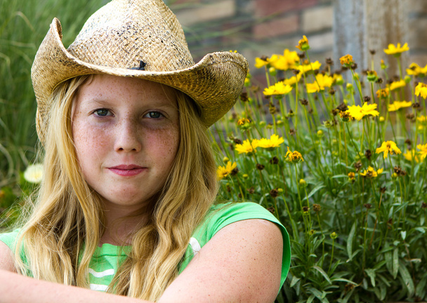 Young girl in cowboy hat. - Zdjęcie, obraz