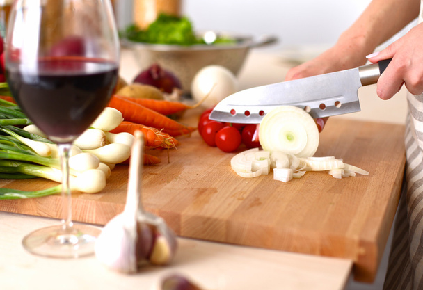 Cooks hands preparing vegetable salad - closeup shot - Фото, изображение