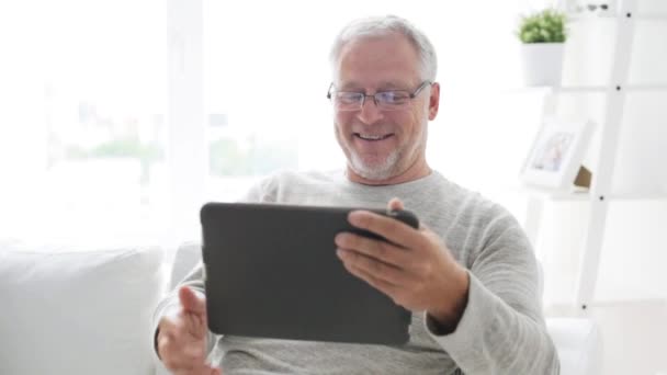 senior man having video call on tablet pc at home 116 - Filmati, video