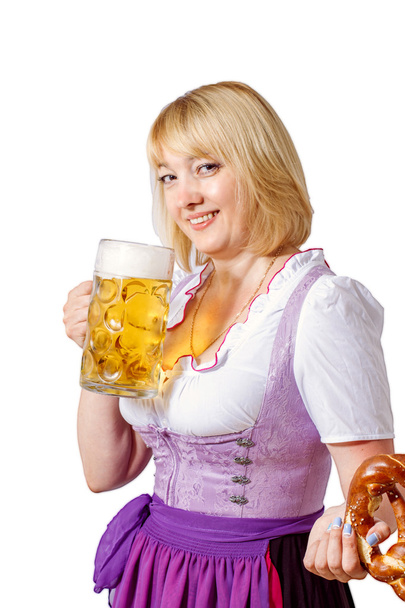 Beautiful woman with a beer mug and pretzel - Фото, изображение
