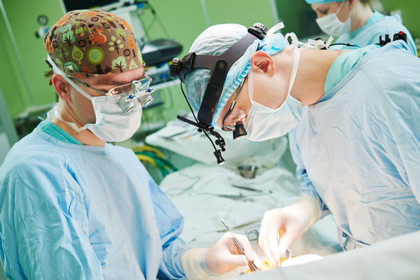 male cardiac surgeon at child cardiosurgery operating room - Foto, Imagem