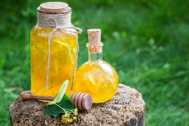Tasty and homemade liqueur with honey, linden and alcohol - Φωτογραφία, εικόνα