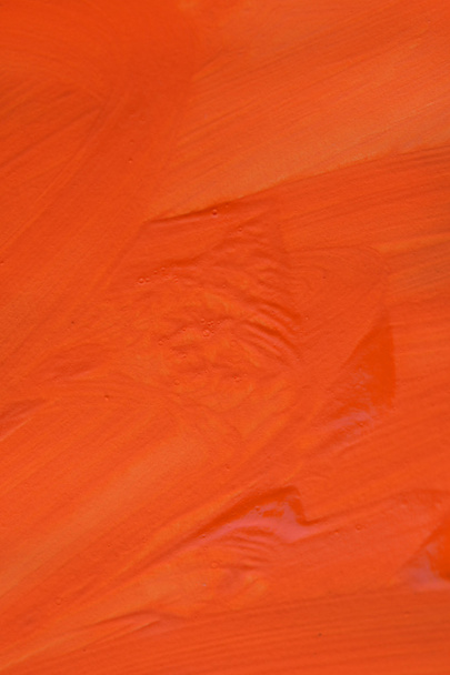 Pociągnięcia pędzlem pomarańczowy farby na powierzchni - Zdjęcie, obraz