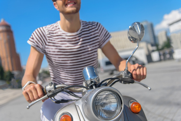 Happy guy traveling by motorbike - Фото, изображение
