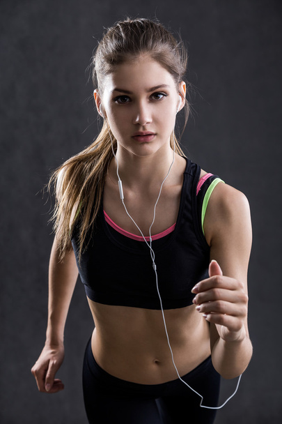 Running Girl in sportswear - Foto, Imagen