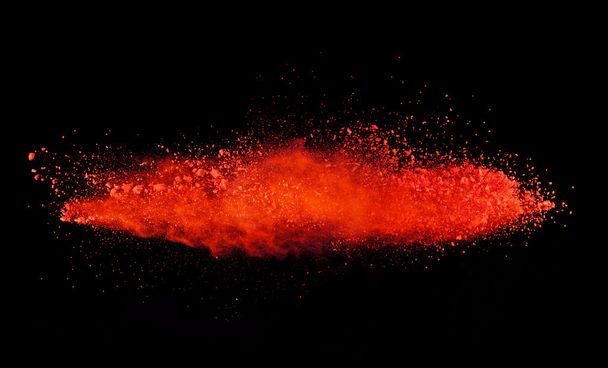 Explosion of red powder on black background - Foto, imagen