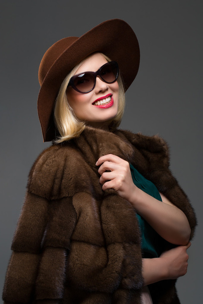 Beautiful mature woman in natural fur coat - Photo, Image