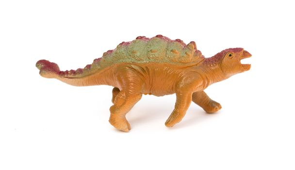 kant weergave bruin plastic dinosaurus speelgoed op een witte achtergrond - Foto, afbeelding
