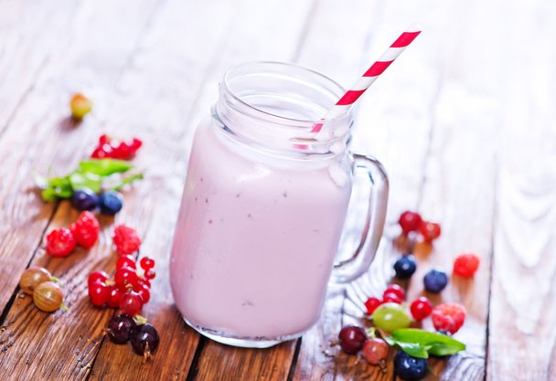 glass of yogurt with berries - 写真・画像