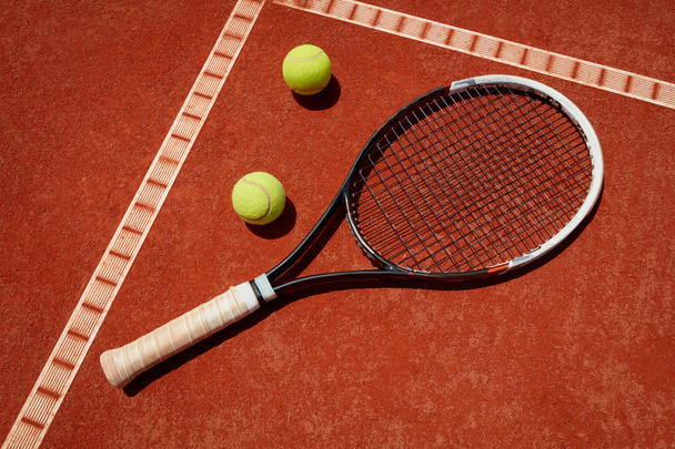 Close up racket and balls on tennis terrain - Photo, image
