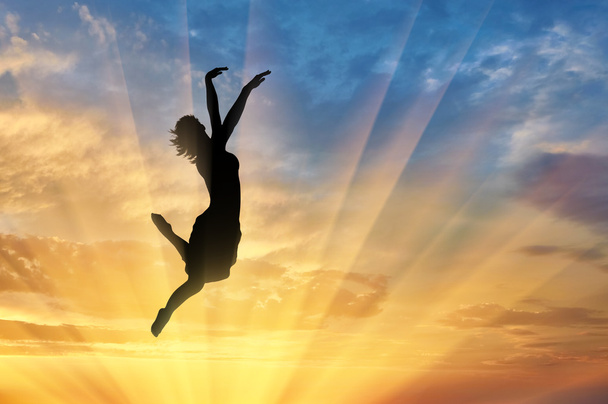 Happy woman jumping at sunset - Zdjęcie, obraz