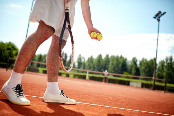 Close up of tennis player's legs serving - Foto, Imagen