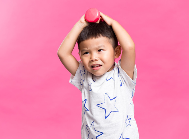 Asian boy holding dumbbell - Photo, Image