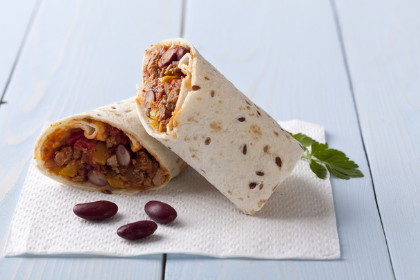 burritos wraps with meat beans and vegetables  - Photo, image