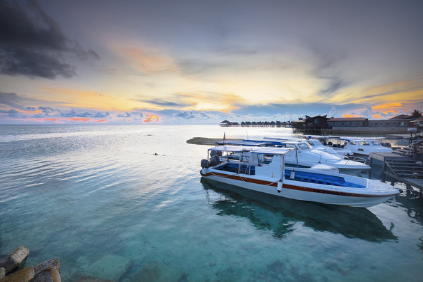 Spead boat with beautiful sunset background in island  - Photo, Image