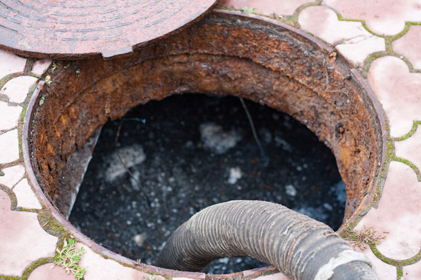 pumping sewage from the hole - Photo, Image