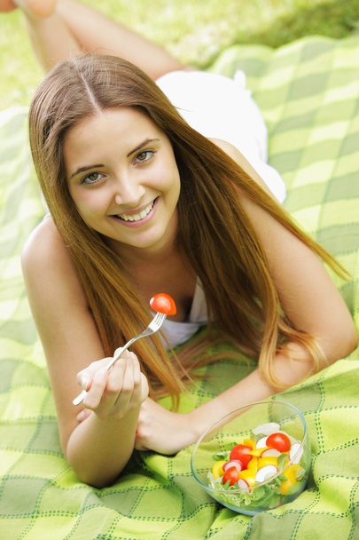 Healthy woman eating salad - 写真・画像