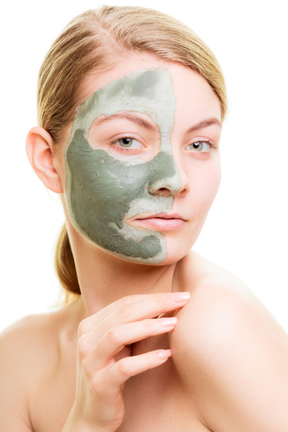 Woman in clay mud mask on face isolated on white. - Φωτογραφία, εικόνα