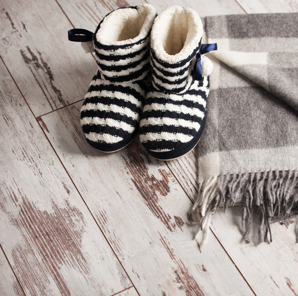 Warm slippers on the background floor - Foto, Bild