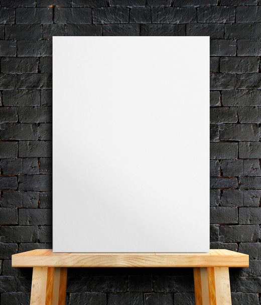 Blank White paper poster on wood table at black stone wall,Templ - 写真・画像