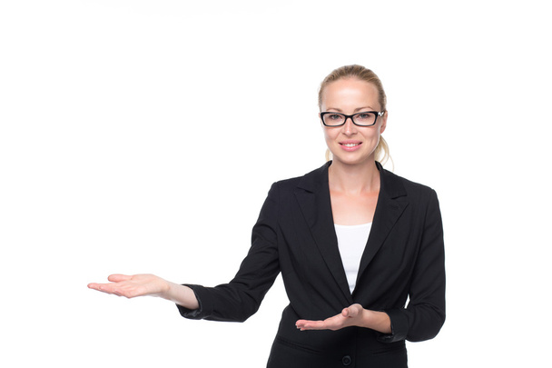 Business woman showing hand sign to side. - Foto, afbeelding