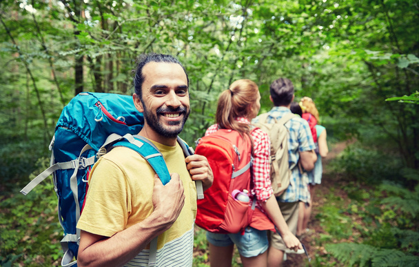 group of smiling friends with backpacks hiking - Φωτογραφία, εικόνα