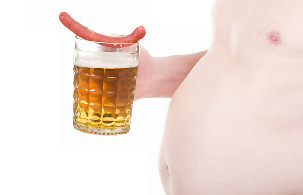 A man with a beer and a sausage - 写真・画像