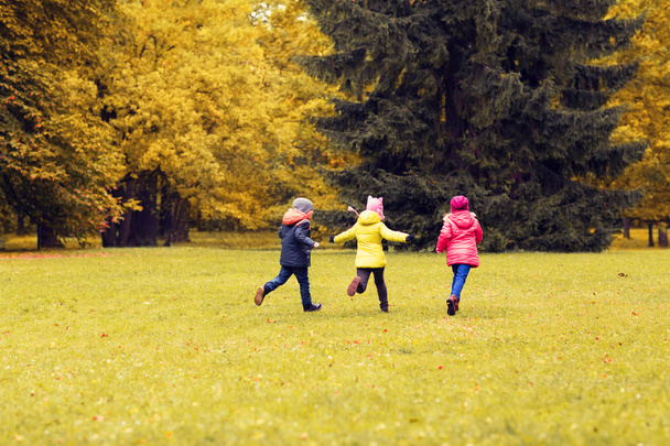 group of happy little kids running outdoors - Fotografie, Obrázek